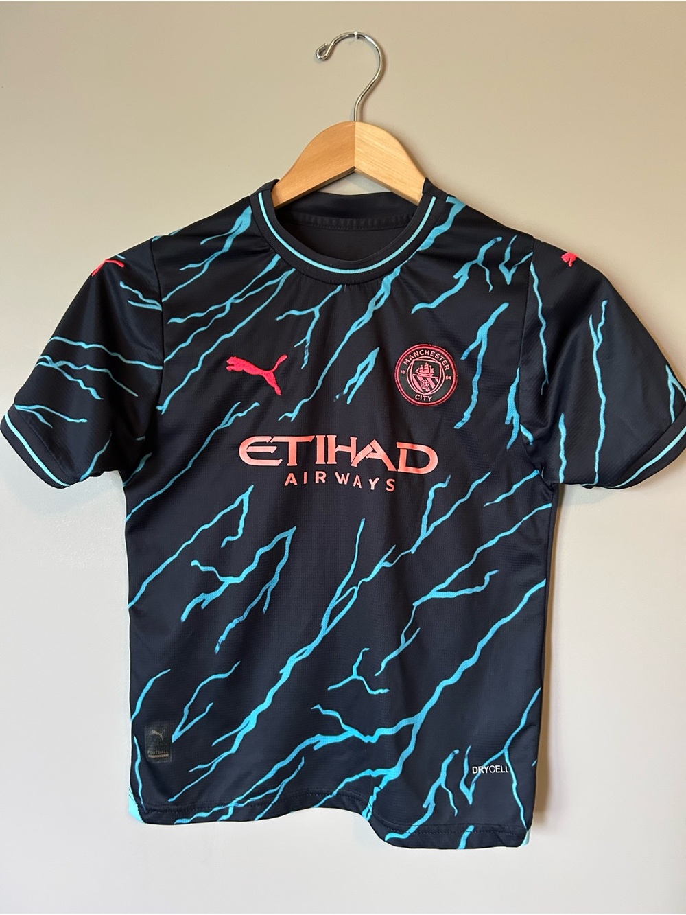 Puma Kids Haaland Man City Navy Jersey with Teal Lightning and Pink Accents